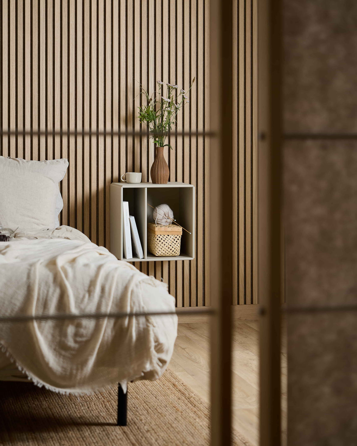 Arka Bookcase in beige styled in a living space
