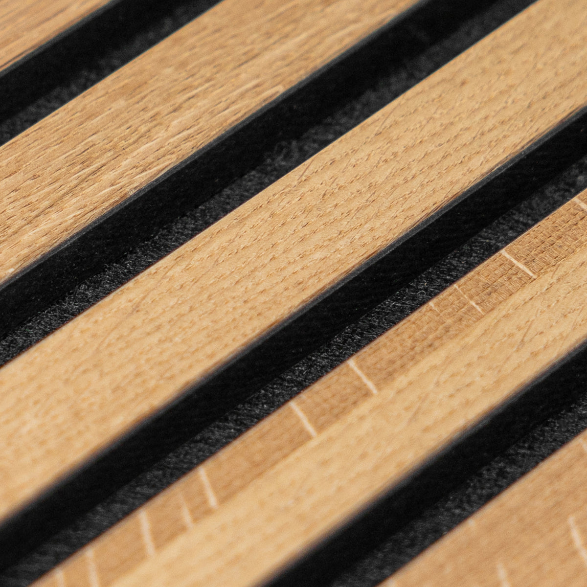 Close-up of real oak veneer on an Akupanel acoustic slat panel