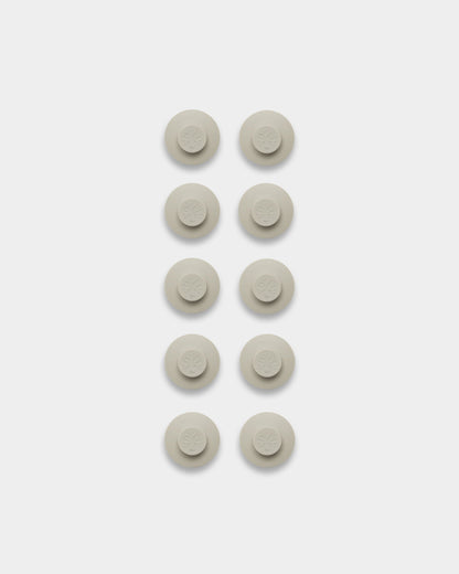 Ten light beige Dupps, accessory for hanging posters and frames on Akupanel acoustic panels